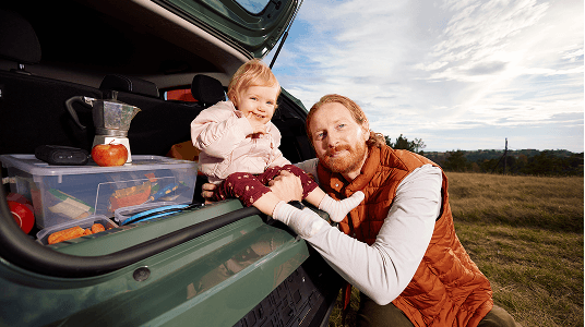 Father and daughter outdoors, a warm moment